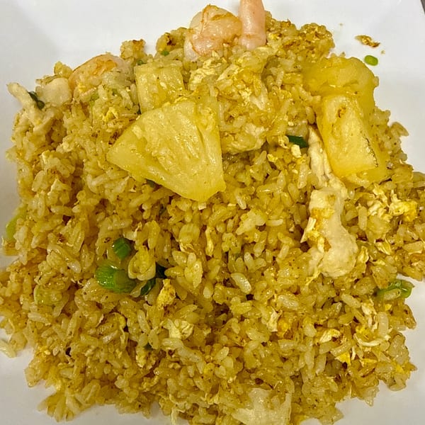 Close-up of Gourmet Asian 888's pineapple fried rice with shrimp, chicken, and egg.