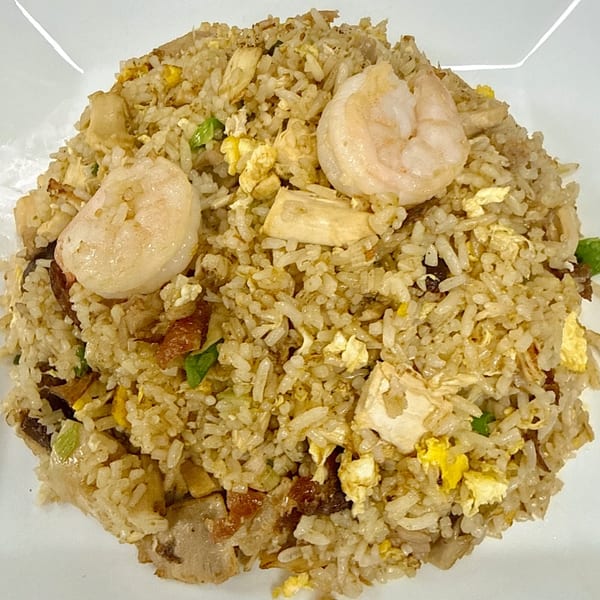 Close-up of Gourmet Asian 888's house special fried rice with shrimp, chicken, and pork.