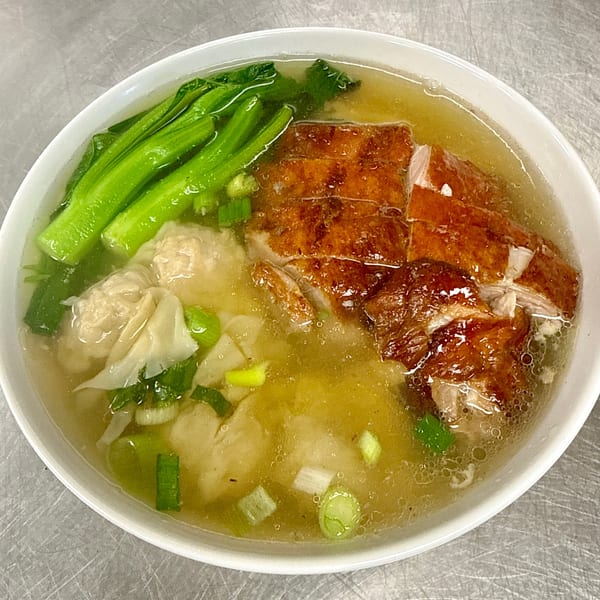 Gourmet Asian 888's Chinese duck wonton noodle soup with green vegetables and scallions.